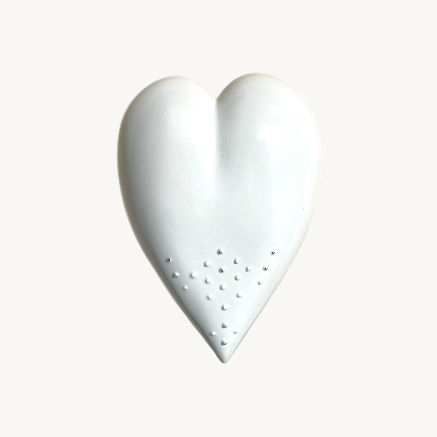Handmade Porcelain Heart with unique design and silver dots for wall hanging.